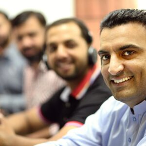 man in white button up shirt smiling
